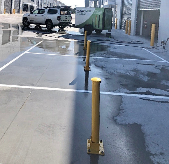 Fold Down Bollards Installed with Global Bollards Truck in Background